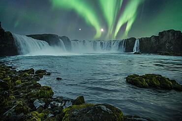 Godafoss waterfall on a night with a beautiful Northern Lights. Iceland