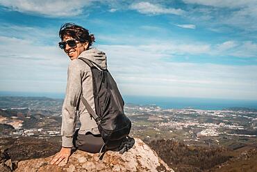 A young girl above Mount Adarra in Gipuzkoa. Basque Country