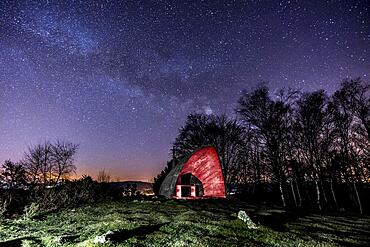 Milky way in the beautiful illuminated hermitage of Agina, Navarra