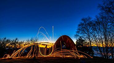 Playing with the steel wool in the hermitage of Agina at dawn, Navarra