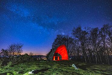 Milky way in the beautiful illuminated hermitage of Agina, Navarra