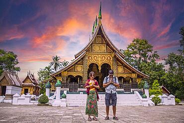 Lovely sunset at a lovely temple in Luang Prabang in summer, Laos, Asia