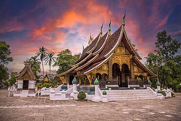 Lovely sunset at a lovely temple in Luang Prabang in summer, Laos, Asia