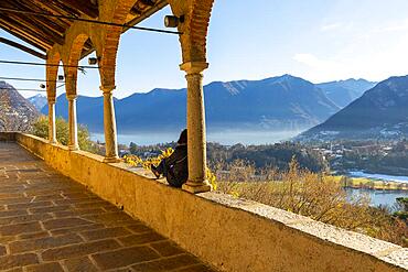 Woman Enjoy Mountain View in a Sunny Winter Day From Church dei Santi Quirico e Giulitta in Lugano, Ticino, Switzerland, Europe