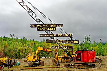 At the Top of the World Highway with signs to the wasteland settlement of Chicken, Interior Alaska, Alaska, USA, North America