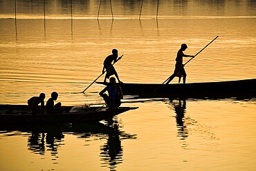 Fishermen fishing in Beki river during sunset, in Barpeta district of Assam, India on 01 Nov. 2019