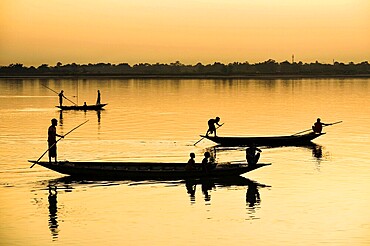 Fishermen fishing in Beki river during sunset, in Barpeta district of Assam, India on 01 Nov. 2019