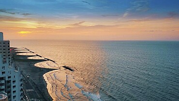 Colombia, scenic view of Cartagena beaches and playas at sunset near historic city center and resort hotel zone, South America