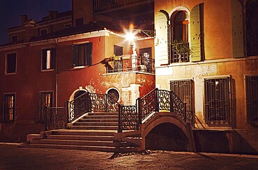 Vintage style image of Venice street at night, Venice, Italy, Europe