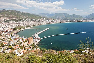 Summer vacations, blue Mediterranean sea and Turkey Alanya east coast beach resort with lighthouse and ship bay view from ancient mountain castle wall