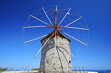 Close-up of an old stone windmill with a clear blue sky in the background, windmills, on a ridge, above Chora, main town Patmos, Patmos, old town, Dodecanese, Greek Islands, Greece, Europe