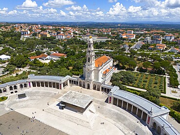 High angle shot of a basilica with a large square surrounded by green trees, sky with clouds, aerial view, Basilica of Our Lady of the Rosary, Santuario de Fatima, place of pilgrimage, Fatima, Fátima, Santarem, Portugal, Europe