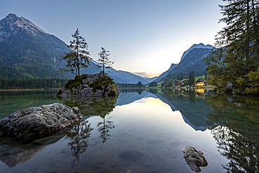 Rocky island with two trees in the lake, reflection in Hintersee, at sunset, Berchtesgaden National Park, Ramsau, Upper Bavaria, Bavaria, Germany, Europe