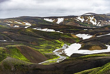 Colourful volcanic landscape with hills and snow, volcanic hot springs, Laugavegur trekking trail, Landmannalaugar, Fjallabak Nature Reserve, Icelandic Highlands, Suðurland, Iceland, Europe