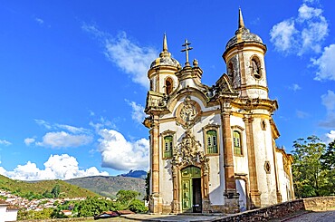 Frontal view of historic baroque church lit by the sun in the famous city of Ouro Preto in Minas Gerais, Ouro Preto, Minas Gerais, Brazil, South America