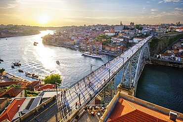 View of Porto city and Douro river and Dom Luis bridge I from famous tourist viewpoint Miradouro da Serra do Pilar on sunset. Porto, Vila Nova de Gaia, Portugal, Europe