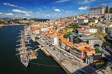 Aerial view of Porto city and Douro river with moored sailling ship from Dom Luis bridge I. Porto, Portugal, Europe