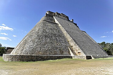 Unesco World Heritage Site, the Mayan ruins of Uxmal, Yucatan, Mexico, Central America, Ancient stone pyramid under a blue sky in an archaeological site, Central America