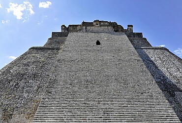 Unesco World Heritage Site, the Mayan ruins of Uxmal, Yucatan, Mexico, Central America, Stone pyramid with long staircases in an archaeological site under a blue sky, Central America