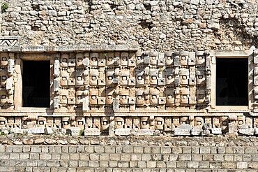 El Palacio, Palace of Kabah, Kabah, Yucatan, Mexico, Central America, detailed view of a stone wall with ancient masks and sculptures, Central America