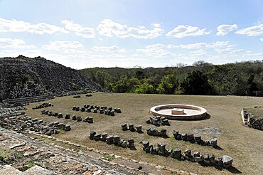 El Palacio, Palace of Kabah, Kabah, Yucatan, Mexico, Central America, open-air archaeological site with scattered stones and a fountain, Central America