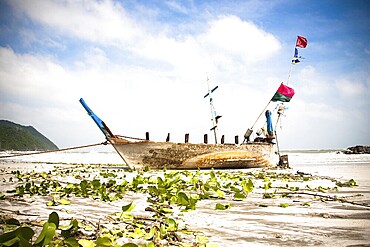 Old Longtail Boat On The Beach