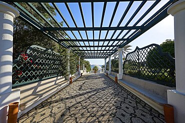 Covered walkway with pergola and geometric patterns, cast shade and view of nature, thermal springs, thermal baths, thermal baths of Kallithea, Kallithea, Rhodes, Dodecanese, Greek Islands, Greece, Europe