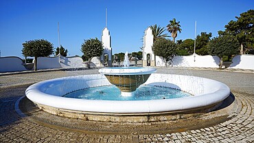 Round fountain with splashing water surrounded by architectural structures and palm trees, thermal springs, thermal baths, thermal baths of Kallithea, Kallithea, Rhodes, Dodecanese, Greek Islands, Greece, Europe