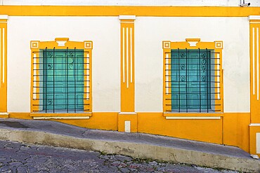 Colorful colonial architecture of historic center of Flores, Guatemala, Central America