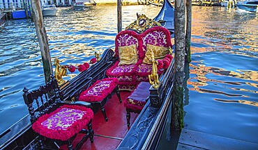 Luxury Gondola waiting for tourists near famous Rialto Bridge in Venice