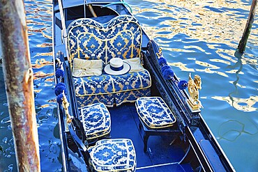 Luxury Gondola waiting for tourists near famous Rialto Bridge in Venice