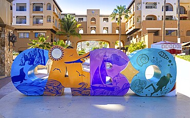 Cabo San Lucas, Los Cabos, Mexico, 2 October, 2021: Los Cabos colorful letters in Cabo San Lucas marina a departure point for cruises, marlin fishing and lancha boats to El Arco Arch and beaches, Central America