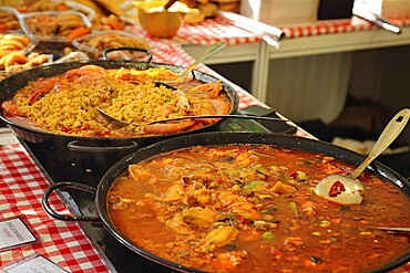 Paella preparation, street market stand near Barcelona Cathedral square