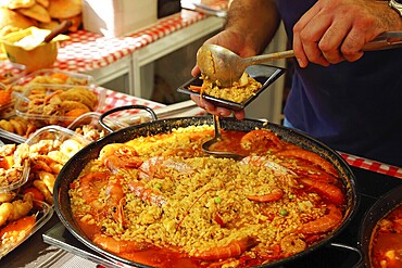 Paella preparation, street market stand near Barcelona Cathedral square