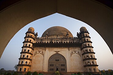 Golgumbaz, a Mughal mausoleum in Bijapur, India is framed by its entrance arch