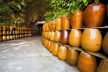 The entrance to an old military tunnel, Tunnel 88 now acts as a storage area for large jars which contain locally distilled alcohol and spirits