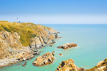 Picturesque cliffs, ocean and headland landscape and Dongju lighthouse on Juguang Island on the Matsu Islands of Taiwan. Horizontal