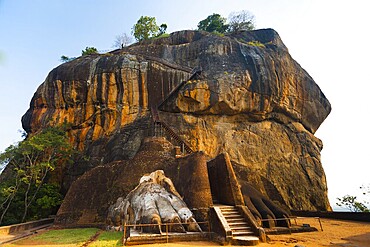 The second level stairs and entrance to the former fortress and monastery of Sigiriya rock, guarded by a pair of lion feet in Sri Lanka