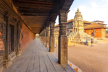 Ornated carved columns and door next to Siddhi Laxmi Temple in Durbar Square of Bhaktapur, Nepal. Before 2015 earthquake damage