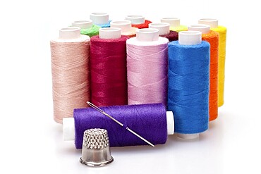 Multi-coloured rainbow threads for sewing with needle and thimble