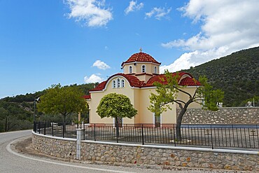 Greek church with red brick dome in a peaceful landscape under a blue sky, Church of the Dormition of the Virgin Mary, Karnezeika, Argolis, Peloponnese, Greece, Europe