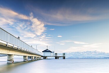 A jetty over a lake with a view of mountains and a cloudy sky in a quiet atmosphere, harbour, Immenstaad, Lake Constance, Baden-Württemberg, Germany, Europe