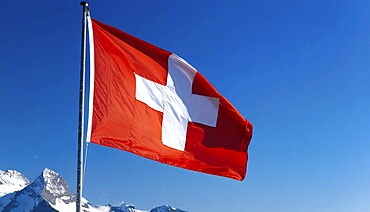 Flag, the national flag of Switzerland flutters in the wind