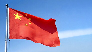 Flag, the national flag of China flutters in the wind