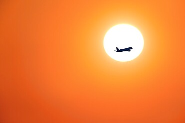 Passenger aircraft after take-off, sunrise, sun, Baden-Württemberg, Germany, Europe