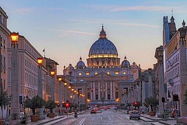 Sunset over St. Peter's Basilica in the Vatican. Evening at the most famous landmark, cloudy sky