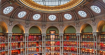 PARIS, FRANCE, OCTOBER 20, 2022 : Oval reading room in National Library, Richelieu site, Paris, france, built by architects Jean-Louis Pascal. and Alfred Recoura, from year 1897 to year 1932