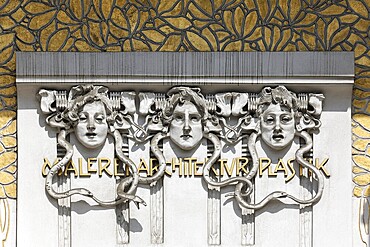 Three women's faces on the Secession building for Contemporary Art, Architecture, Painting, Sculpture, art nouveau decoration, Vienna, Austria, Europe