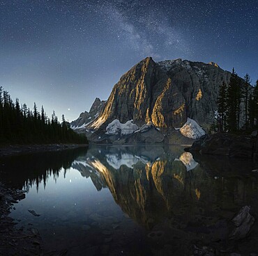 Tranquil mountain scenery reflecting on a lake under a starry twilight sky, Floe Lake, Yoho National Park, Canadian Rockies