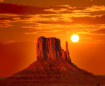Monument Valley West Mitten at sunrise sun orange sky Utah photo mount